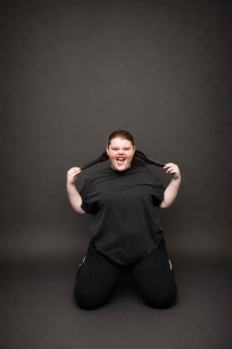 Belong student smiling confidently in a dance portrait